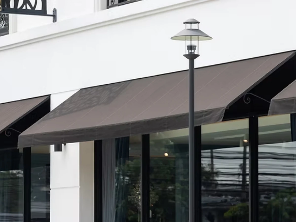 Glass windows under black awnings