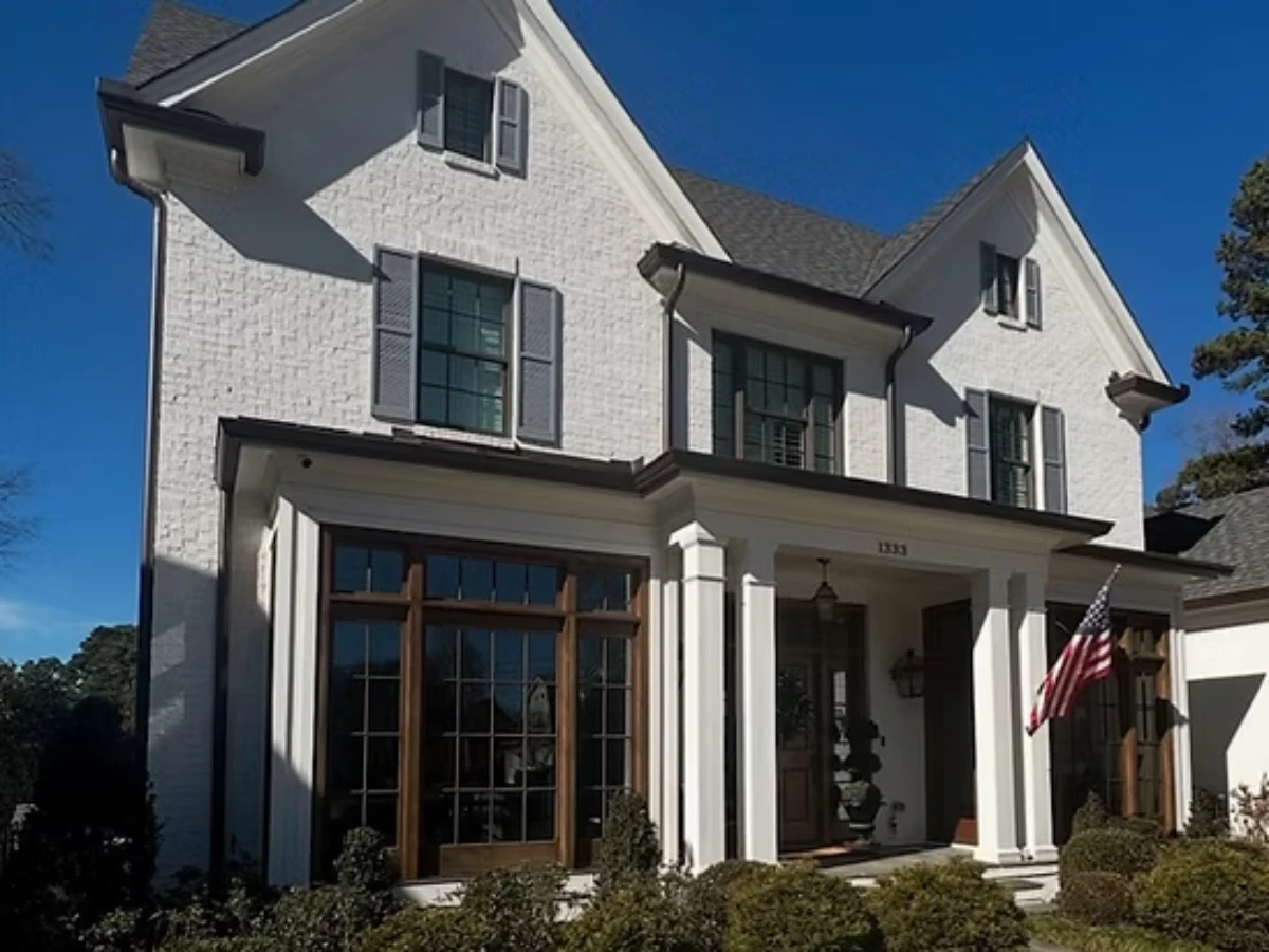 Elegant home with large windows and columns