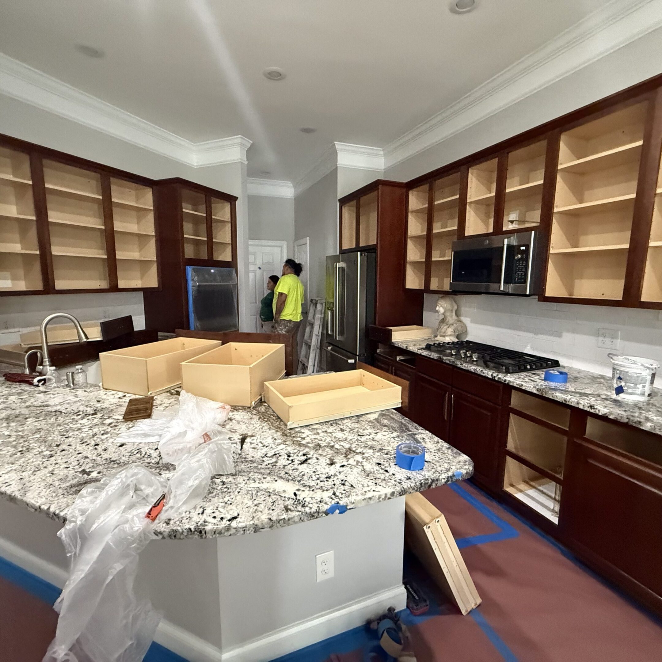 Kitchen under renovation with new countertops and cabinets.